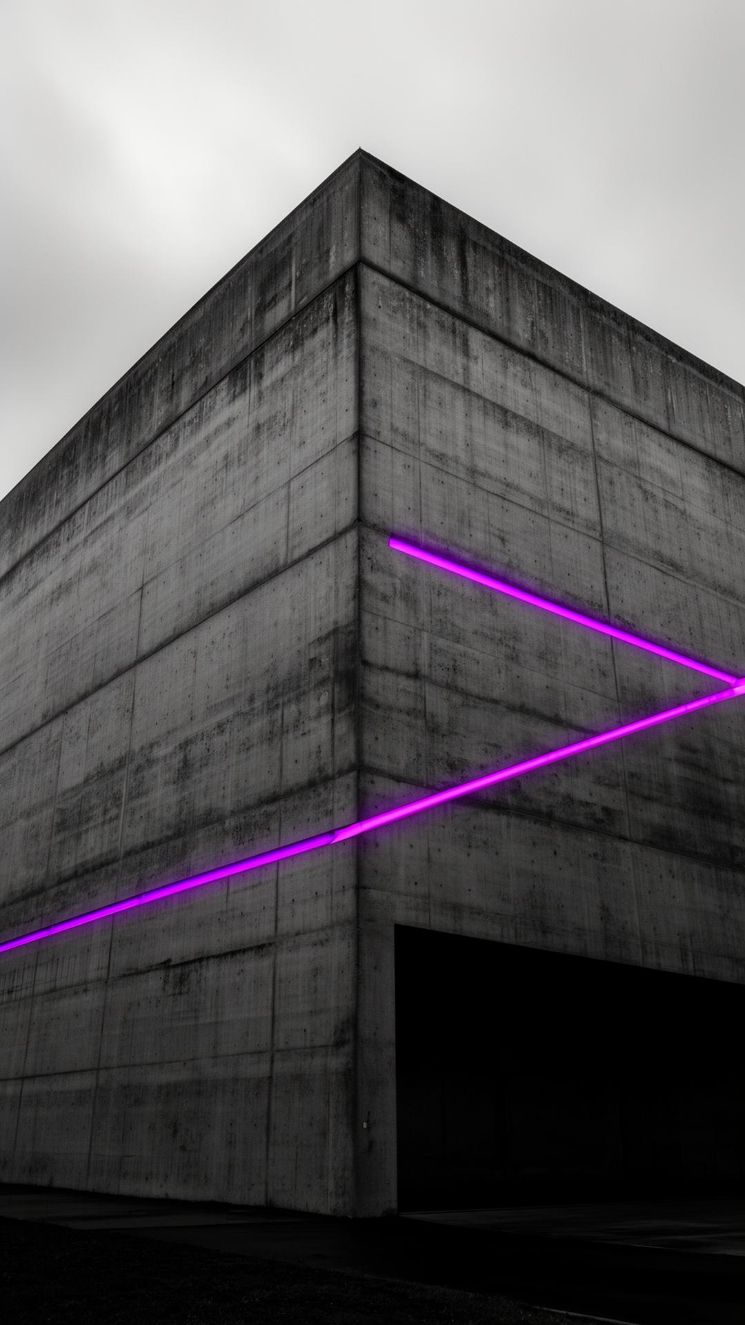 Brutalist concrete monolith with violet neon line